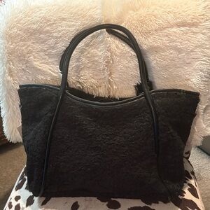Faux shearling and faux leather trimmed tote. New.